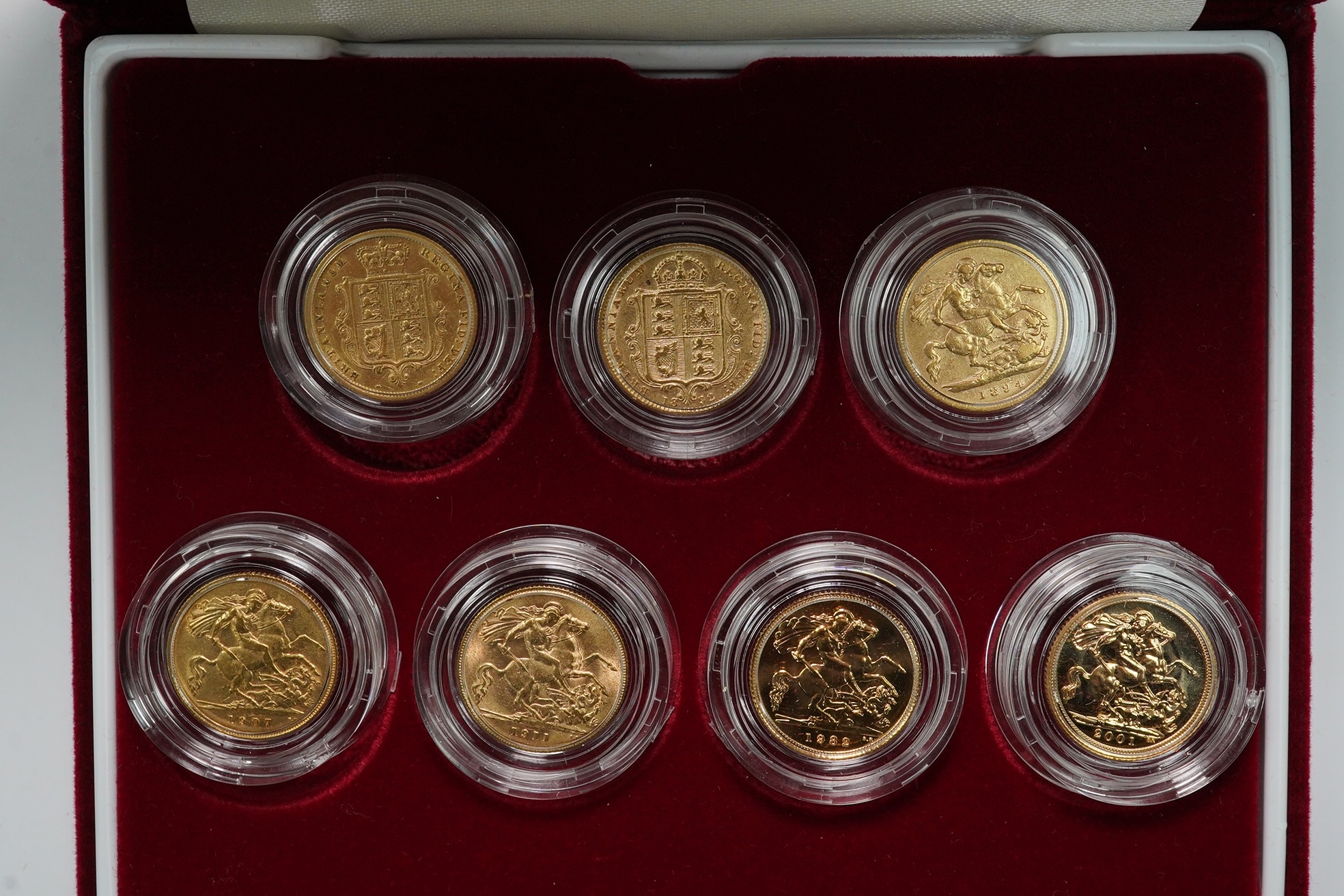 British gold coins, seven half sovereigns, Victoria to Elizabeth II, cased Royal Mint issue ‘The half sovereign portrait collection’ 86/537, comprising 1883 F, 1892 near VF, 1894 near VF, 1907 VF, 1911 VF, 1980 UNC, 2001